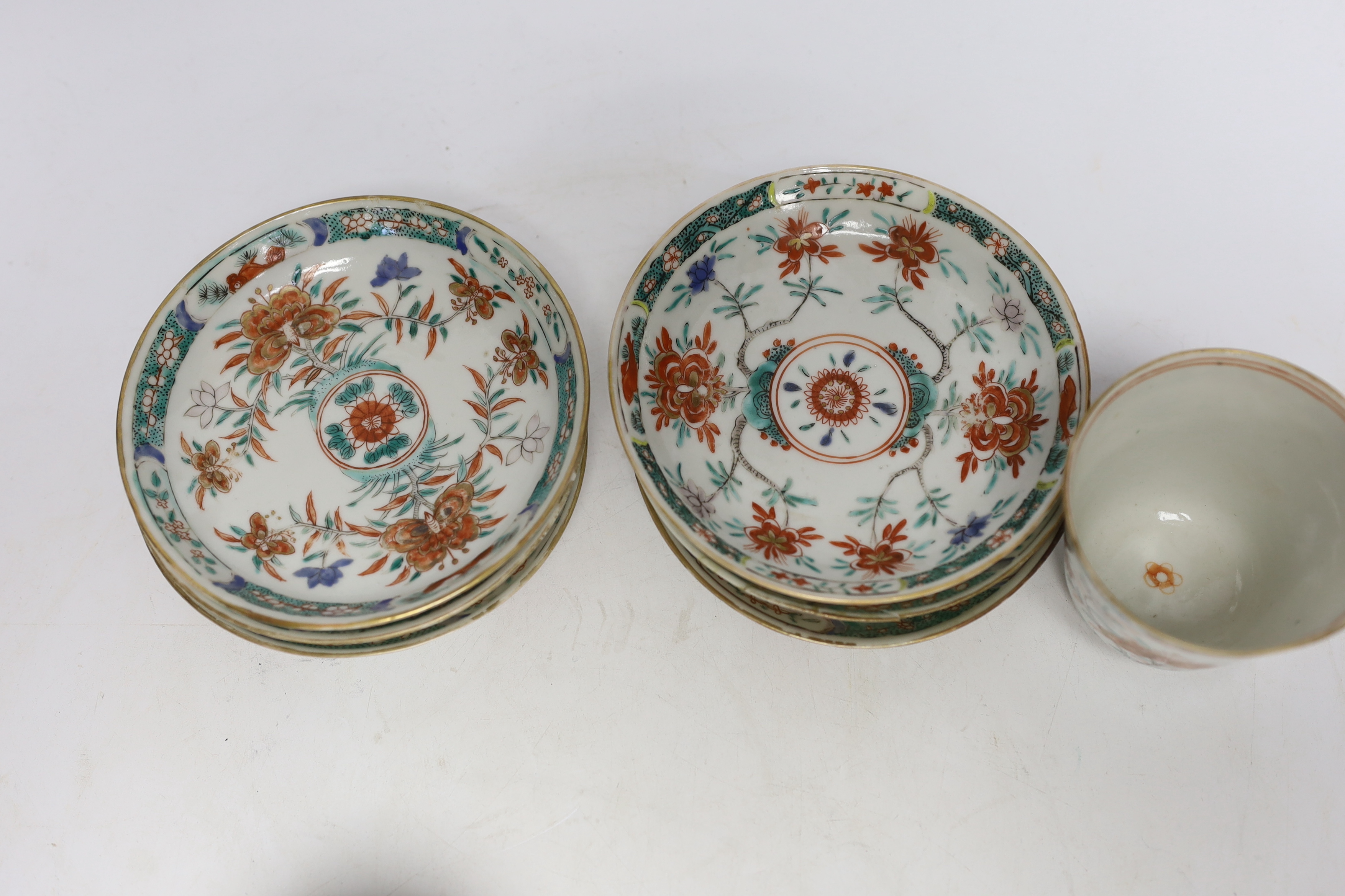A set of six early 18th century Chinese cups and saucers with Dutch enamelled decoration, c.1710, 7.5cm high